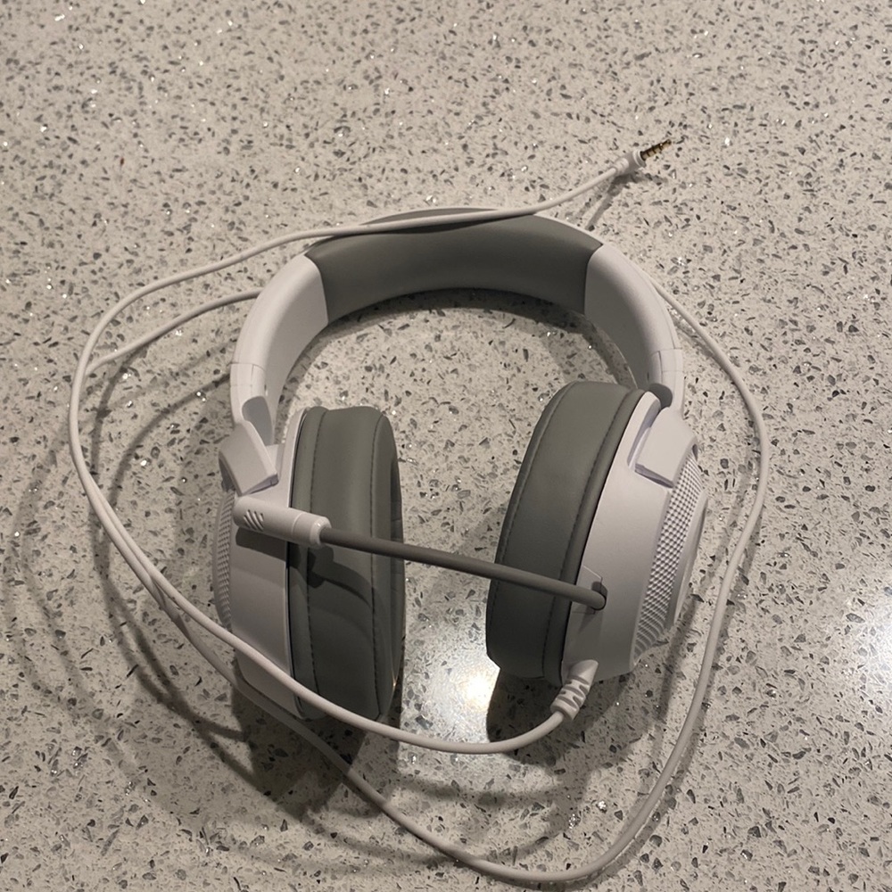 White razor cracking over ear headphones with 3.5 mm heads on jack